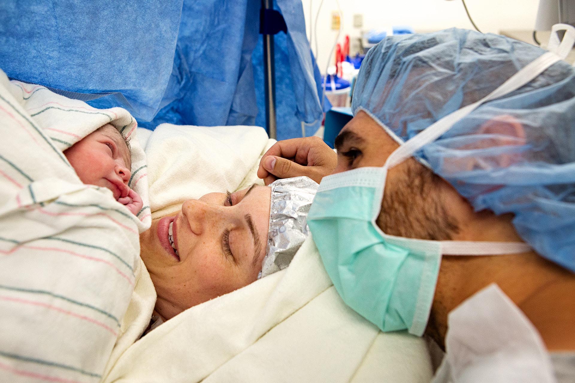 Birth photography photo of a mother and father meeting their baby after a caesarean birth at Glendale Adventist by Leona Darnell