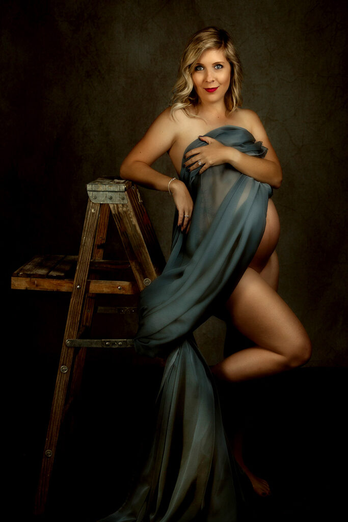 Santa monica maternity portrait of a woman under a blue drape by Birth and Beauty