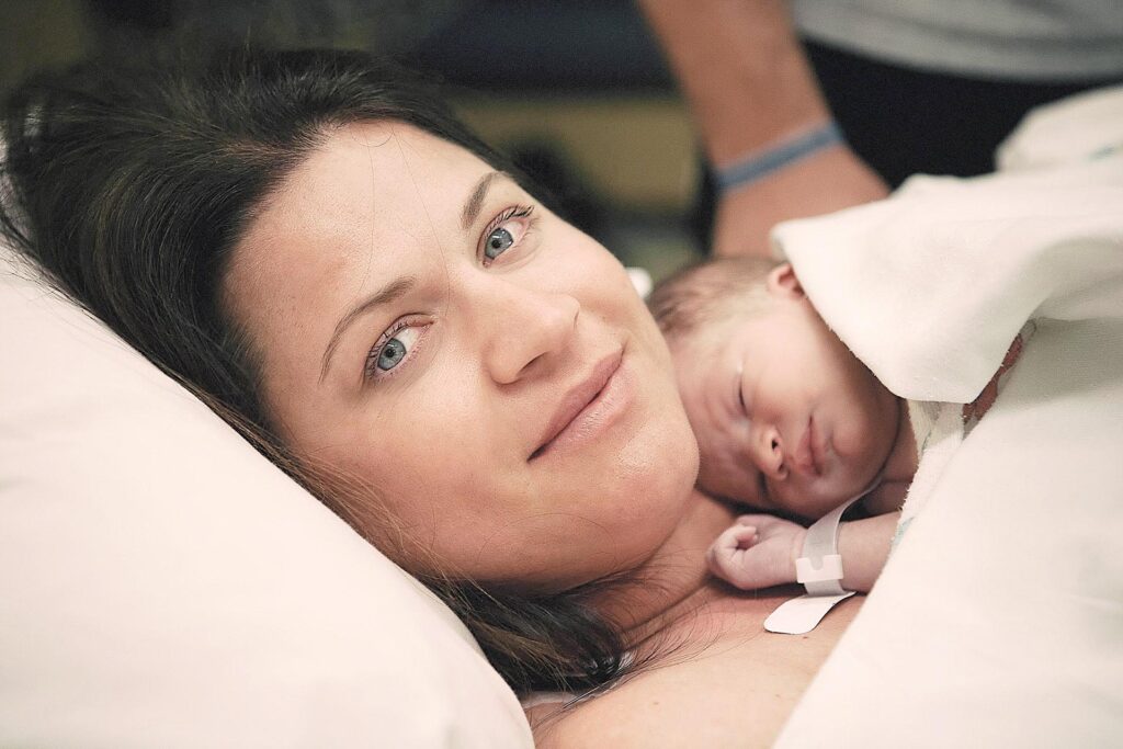 pasadena birth photography image by Leona Darnell showing a mother holding her newborn son.