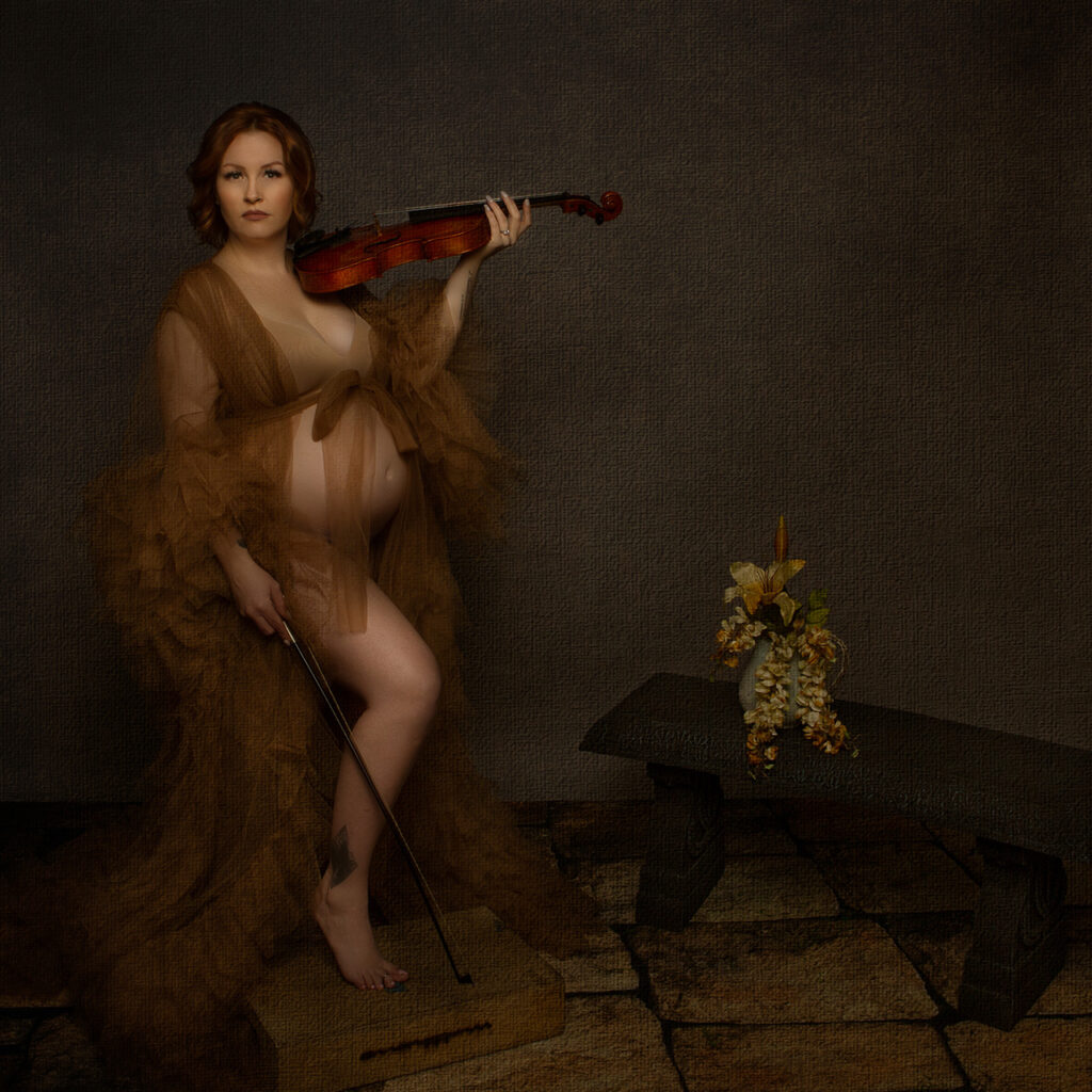 Los Angeles Maternity photographer, Leona Darnell, shows an image of a pregnant mother holding a violin.