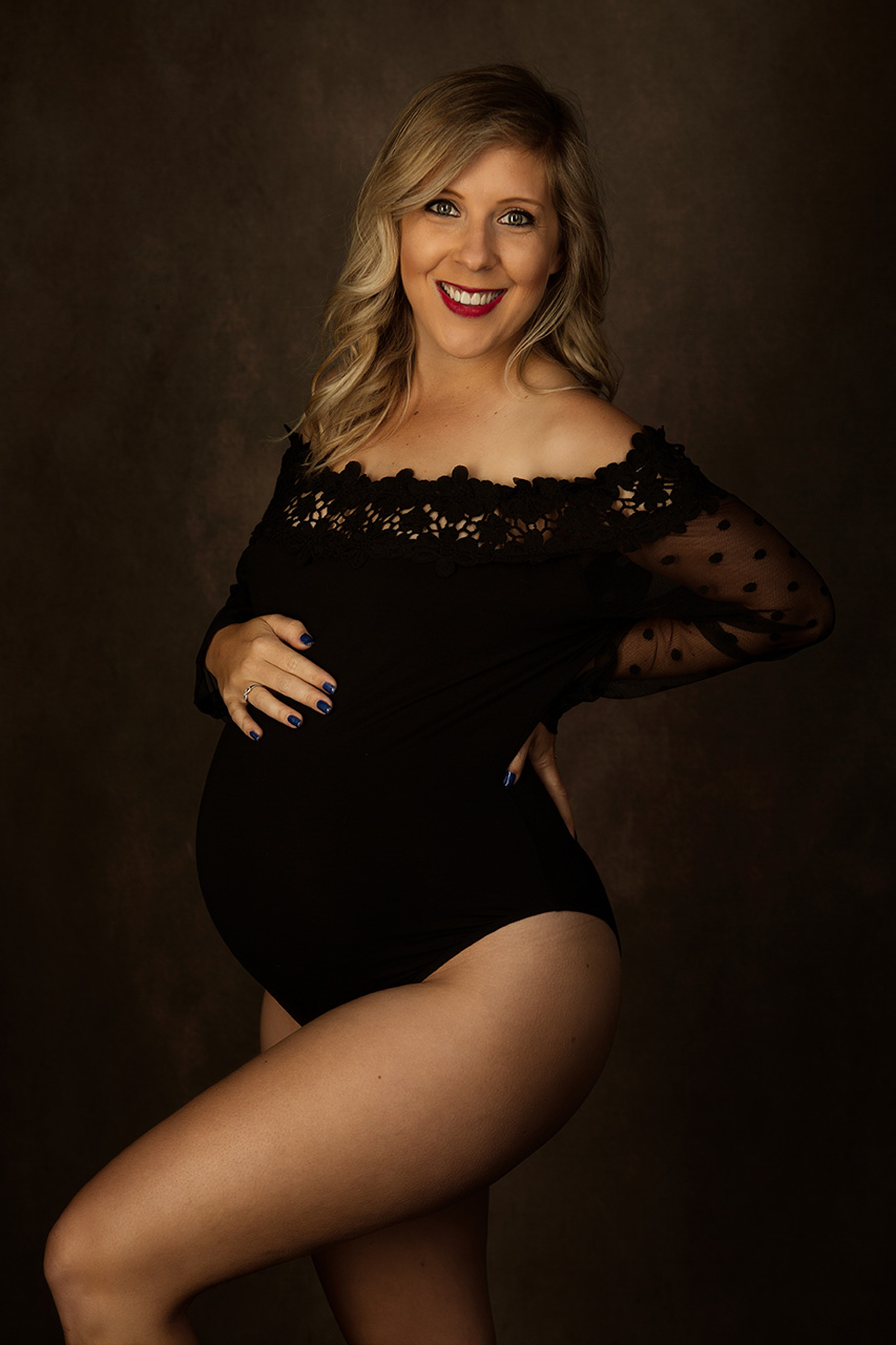 Los Angeles maternity photography photo by Birth and Beauty shows a pregnant woman in a black bodysuit.