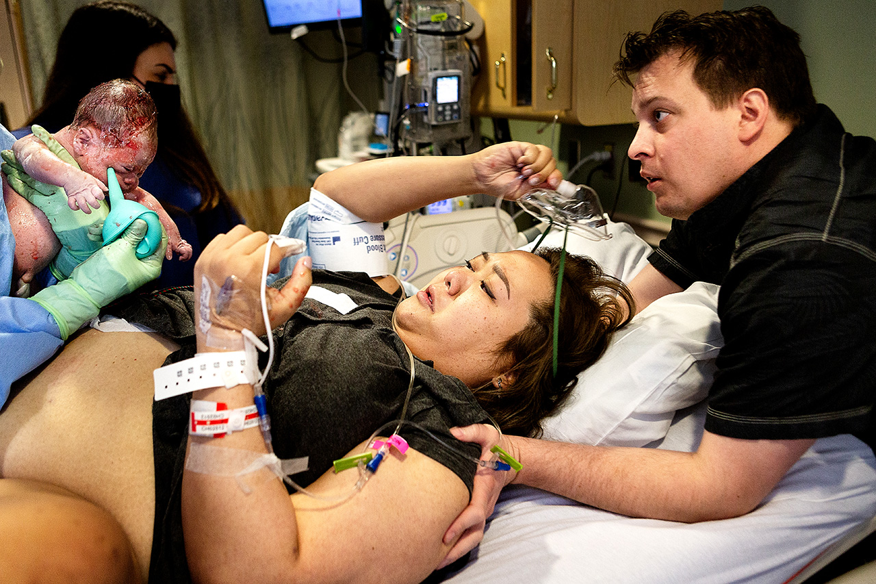 Pasadena birth photographer, Leona Darnell, captures the moment baby is born.