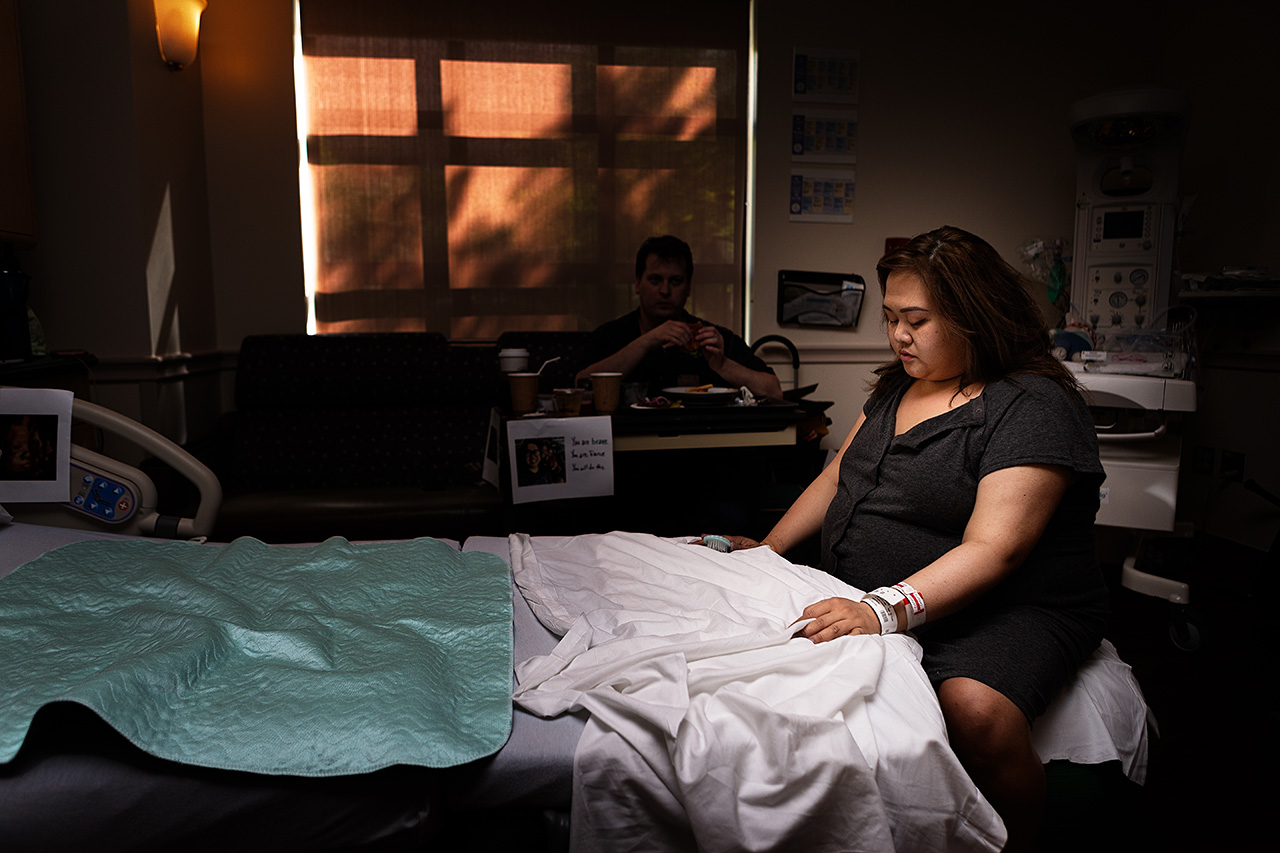 color birth photography photo of a mother laboring by Leona Darnell