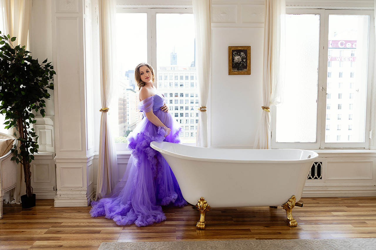 A color maternity portrait by Leona Darnell showing a mom-to-be in purple tulle downtown Los Angeles.