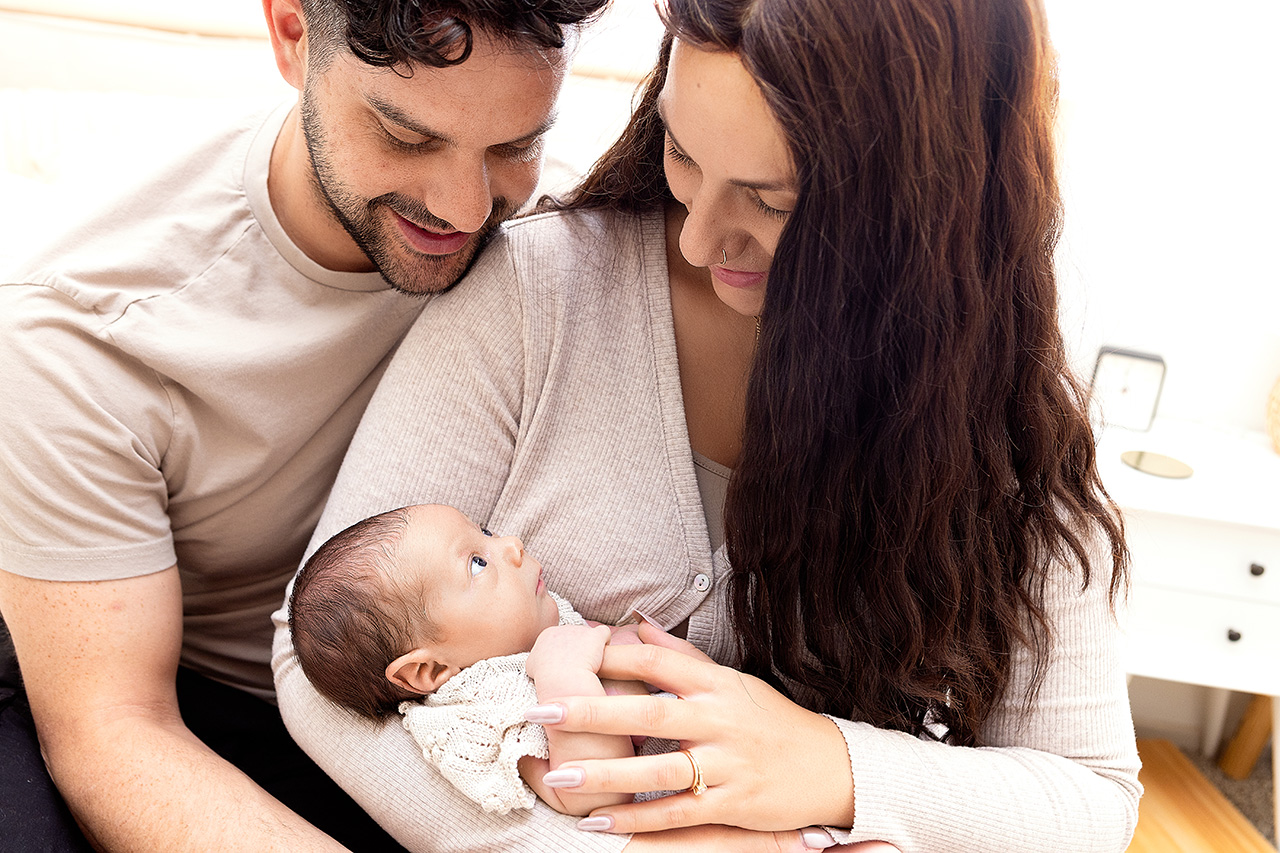 lifestyle newborn session of parents and their new daughter by Birth and Beauty