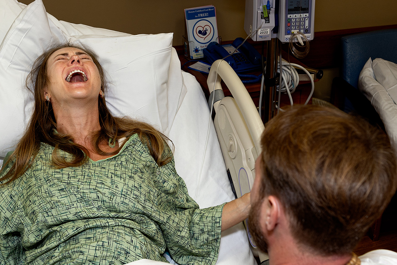 birth photography photo of a woman screaming through a contraction by Birth and Beauty.