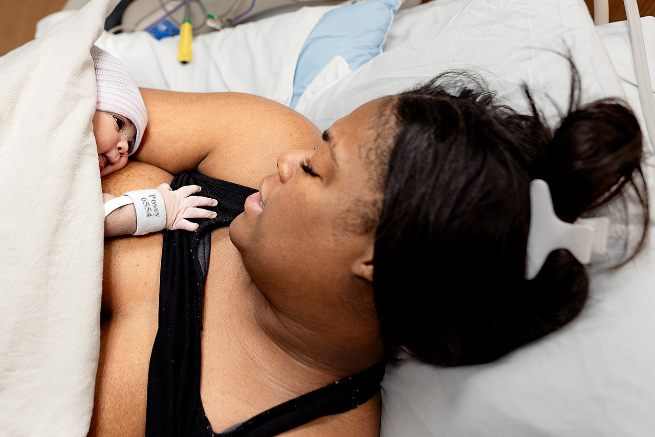 Overhead image of a mother doing skin-to-skin after birth. Photo by Birth and Beauty. 